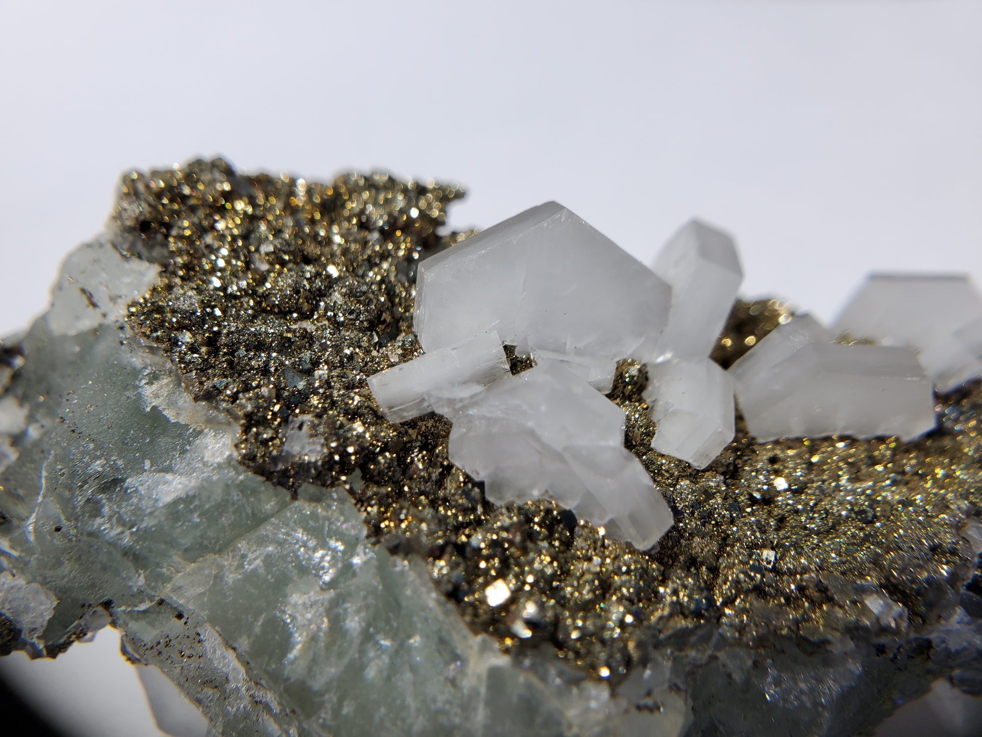 Calcite and Pyrite on Fluorite