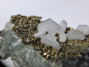 Calcite and Pyrite on Fluorite