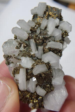 Calcite and Pyrite on Fluorite