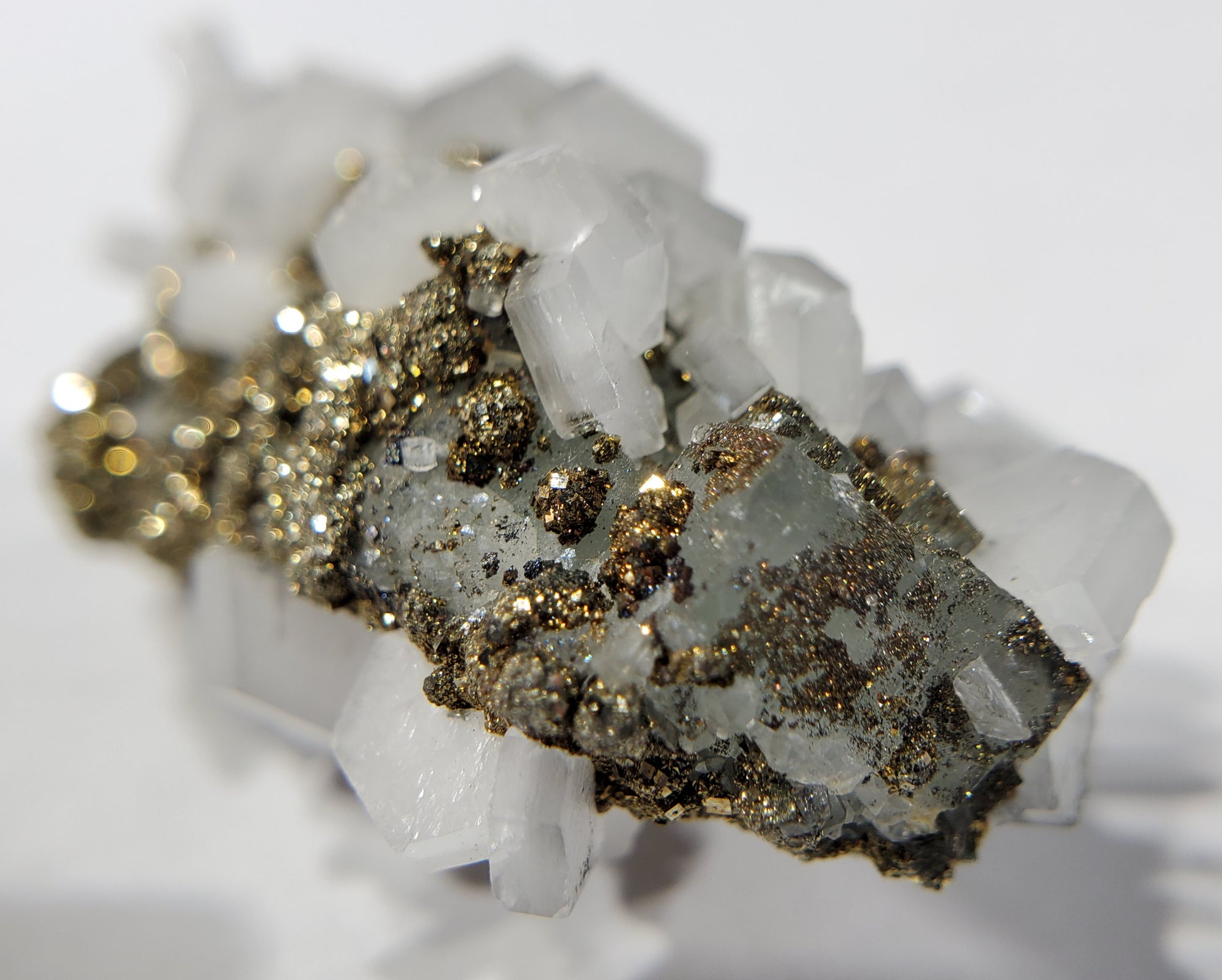 Calcite and Pyrite on Fluorite