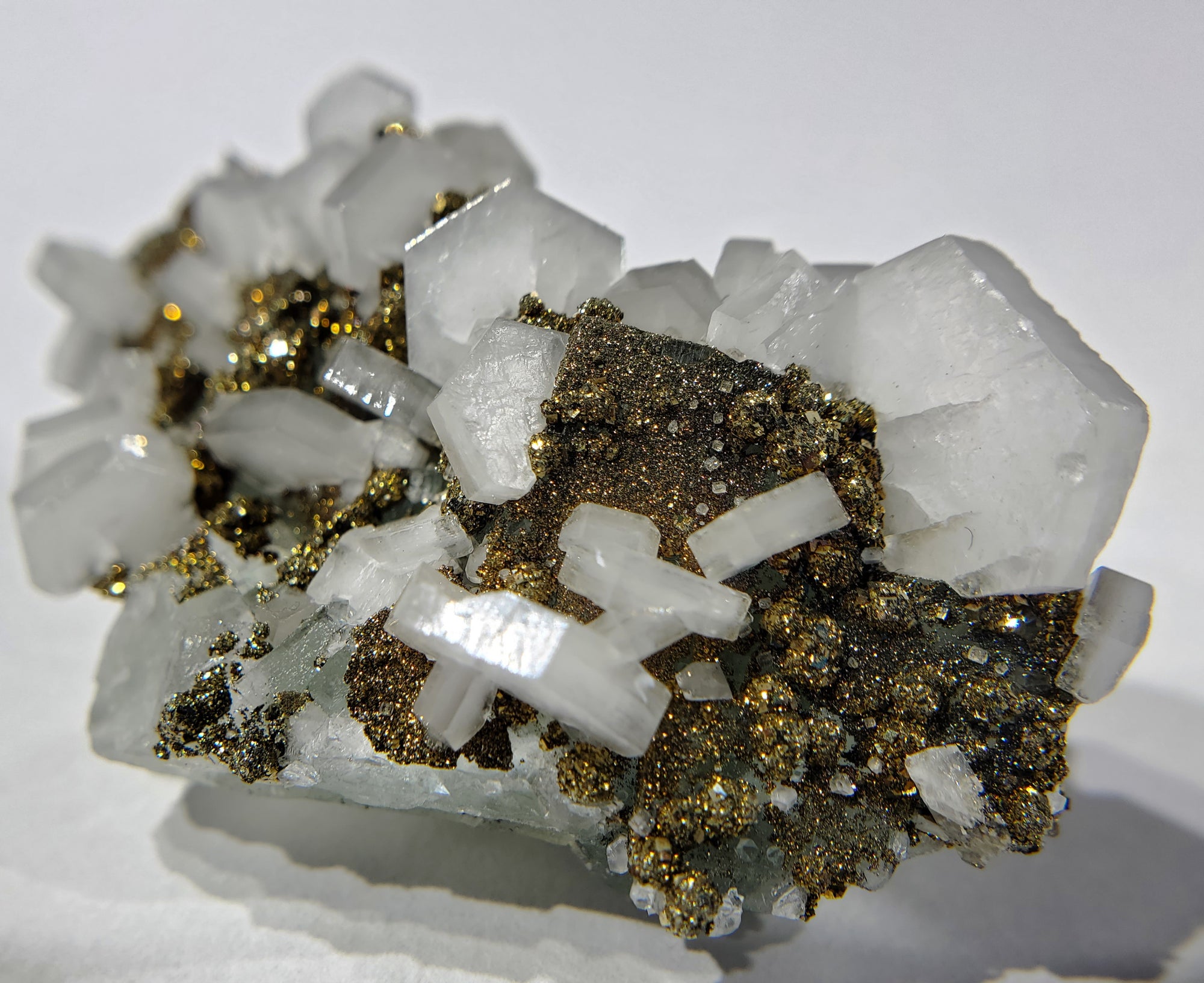 Calcite and Pyrite on Fluorite