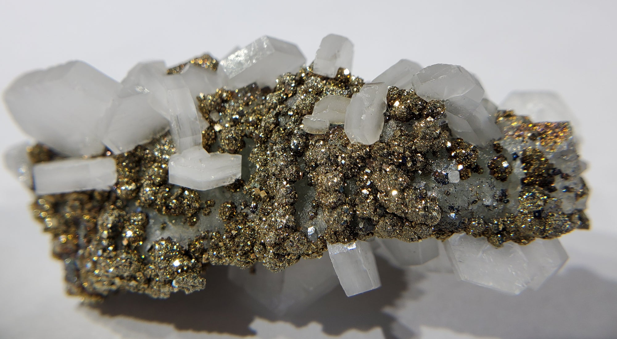 Calcite and Pyrite on Fluorite