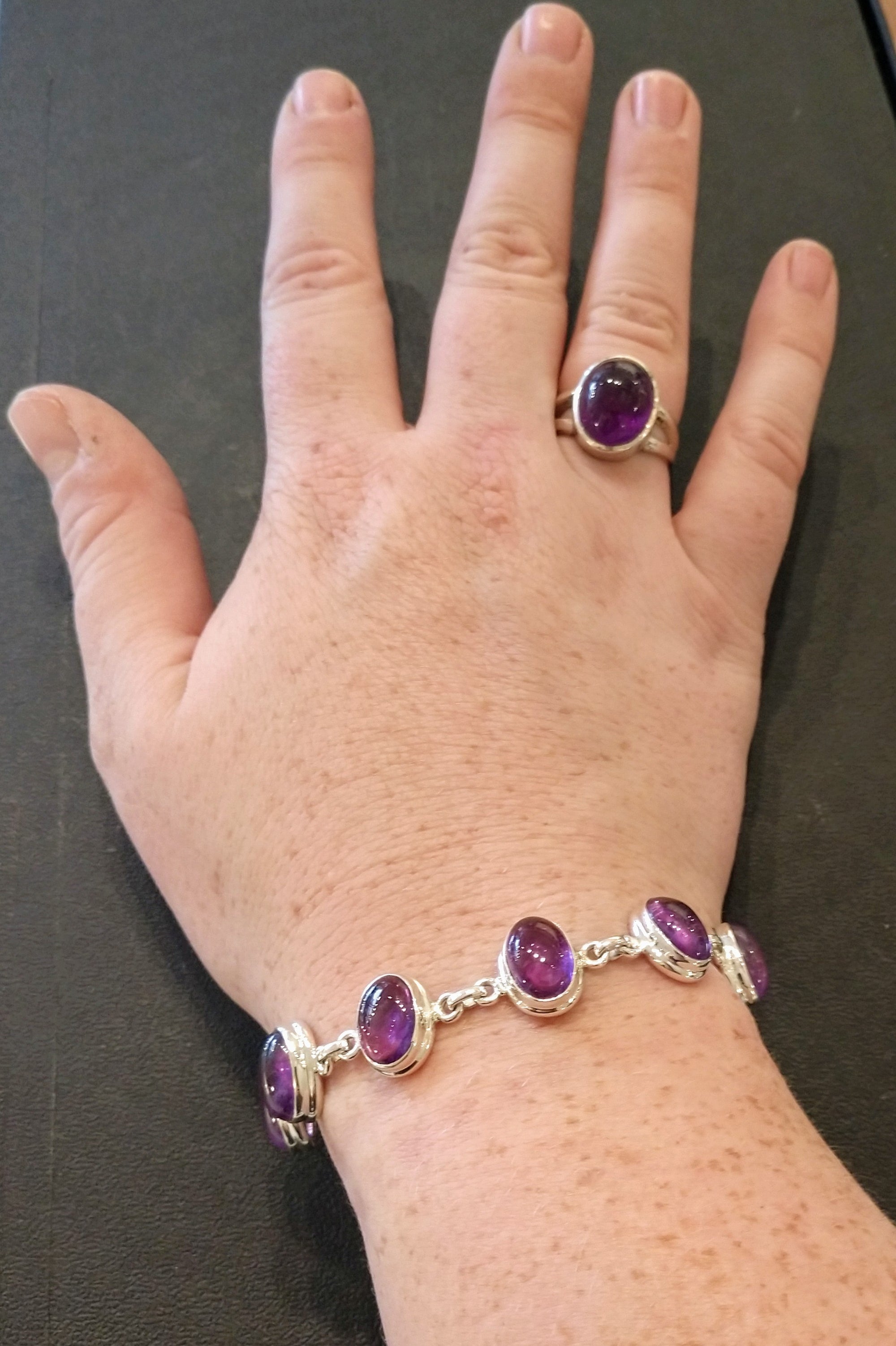 Amethyst bracelet in sterling silver setting.